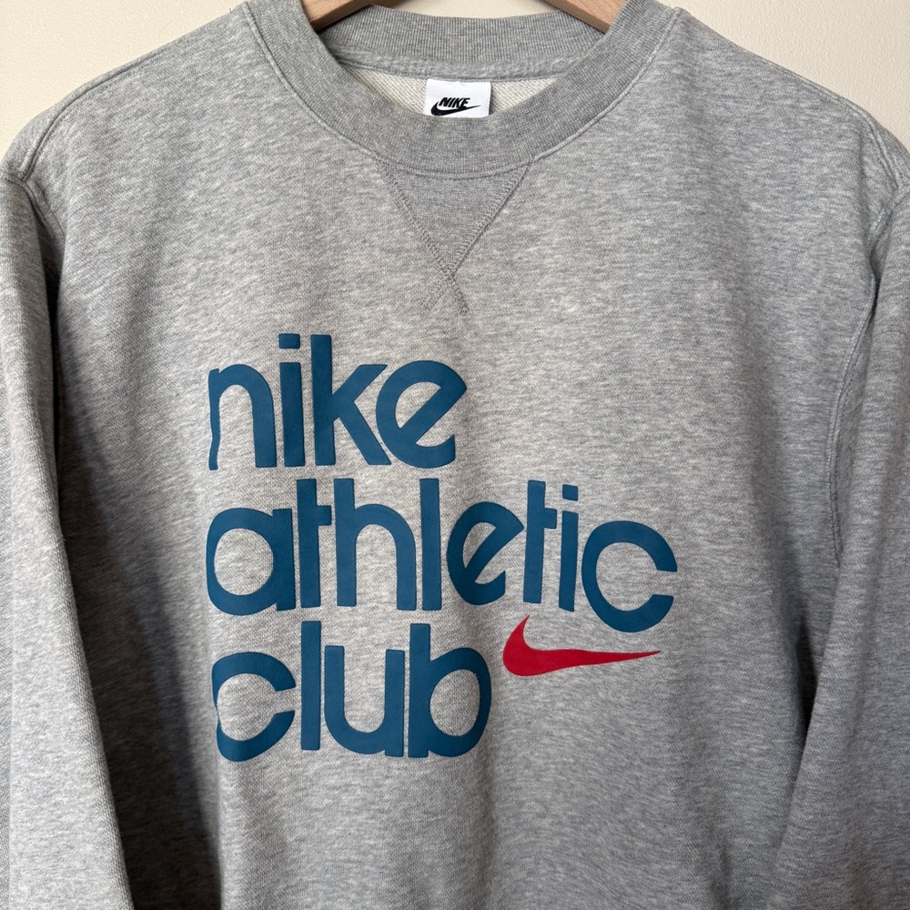 Nike Gray Crewneck Sweatshirt with Blue 'nike athletic club' Logo and Red Swoosh